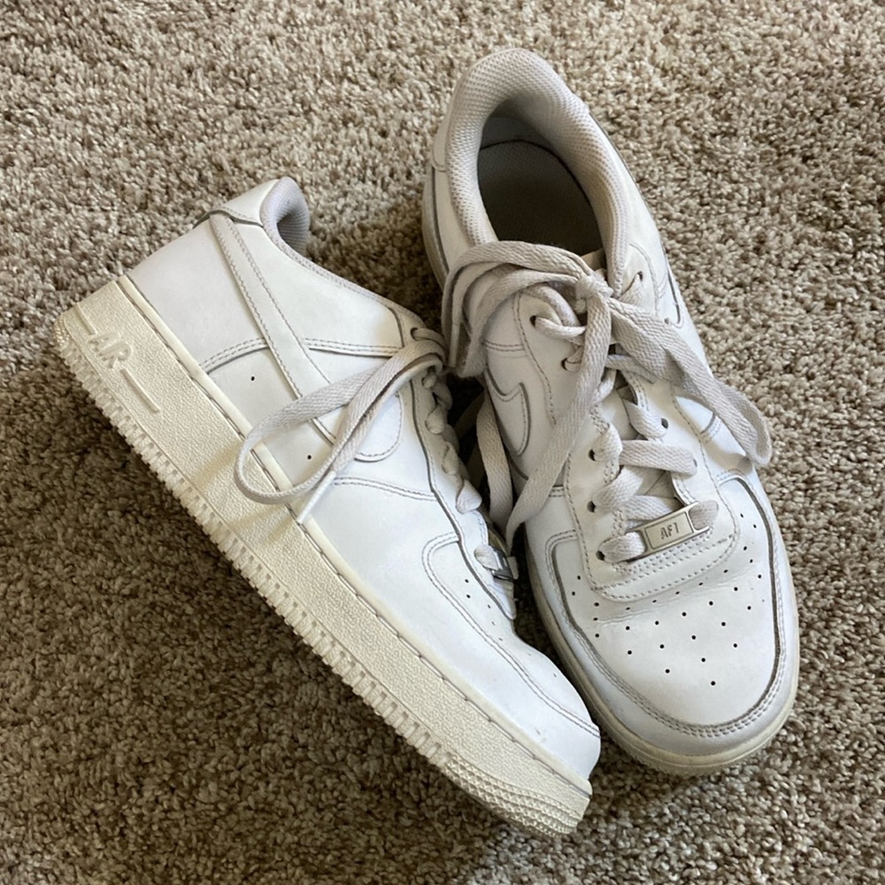 White Nike Air Forces youth.